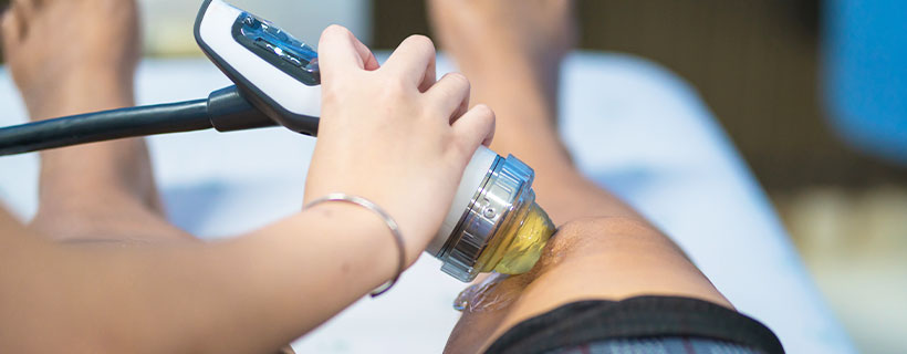patient receiving shockwave therapy in Wilmington for auto accident injury relief